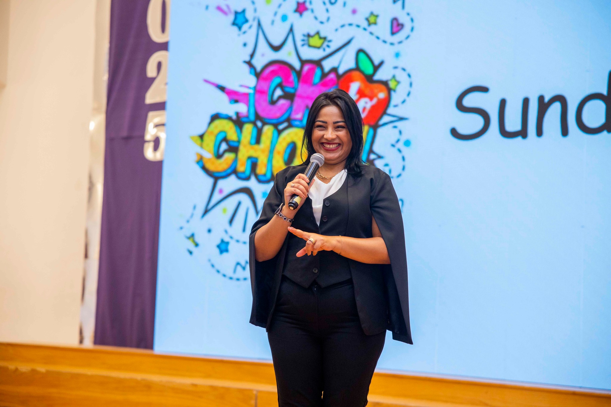 Royal Kings Schools presenter speaking on stage