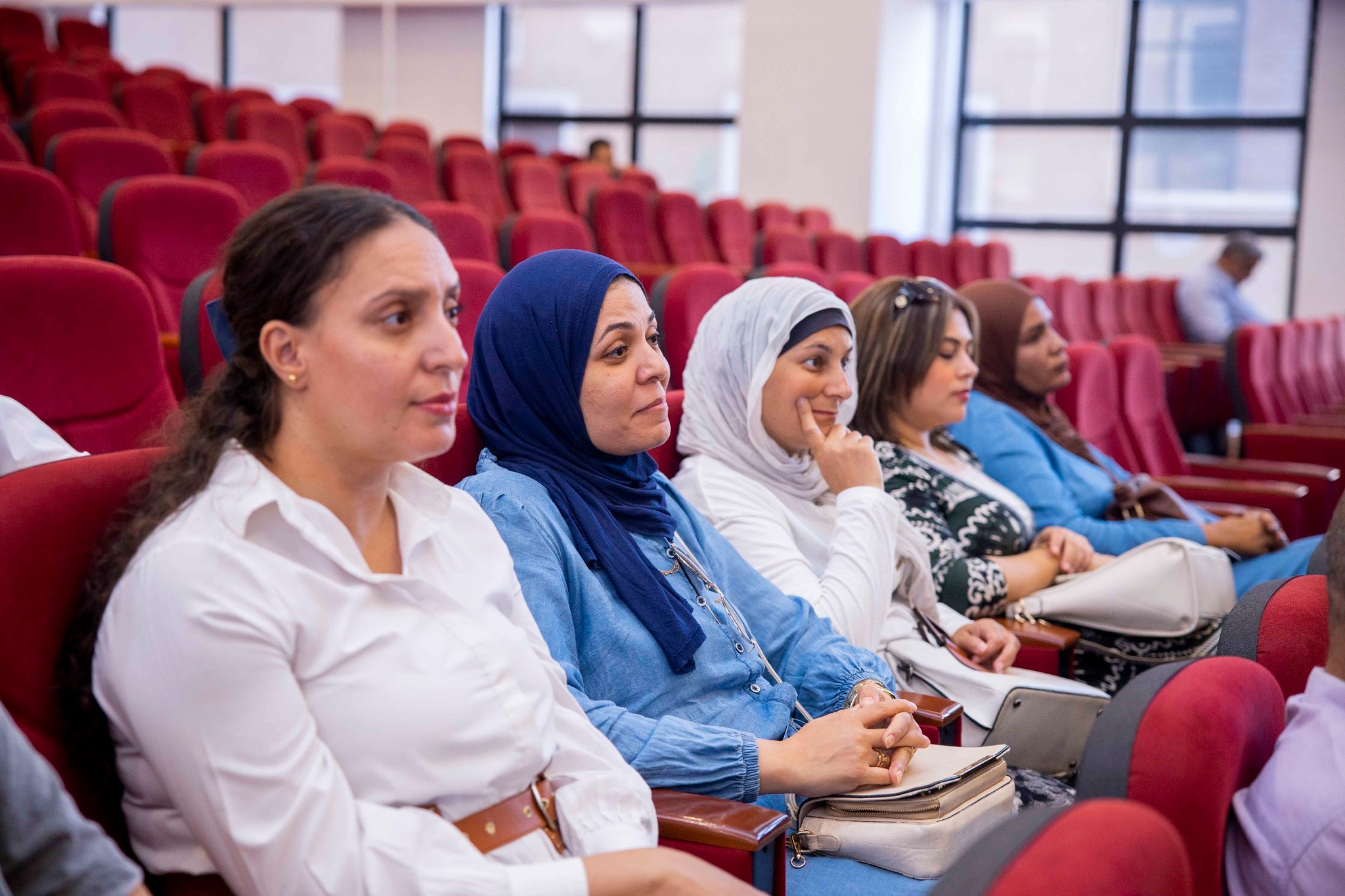 Parents seated during a Royal Kings Schools event