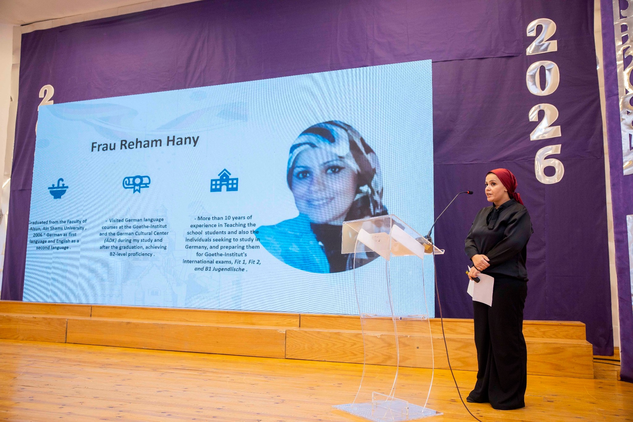 Royal Kings Schools staff presentation with speaker at podium